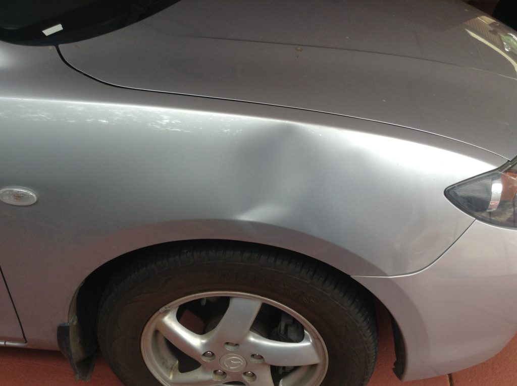 Large dent on fender